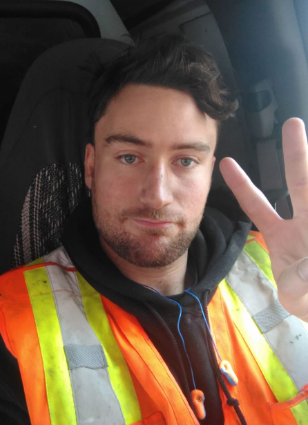 Jacob wearing a construction vest