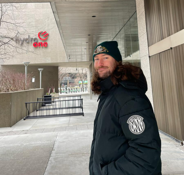 Jacob standing outside the Hydro One office